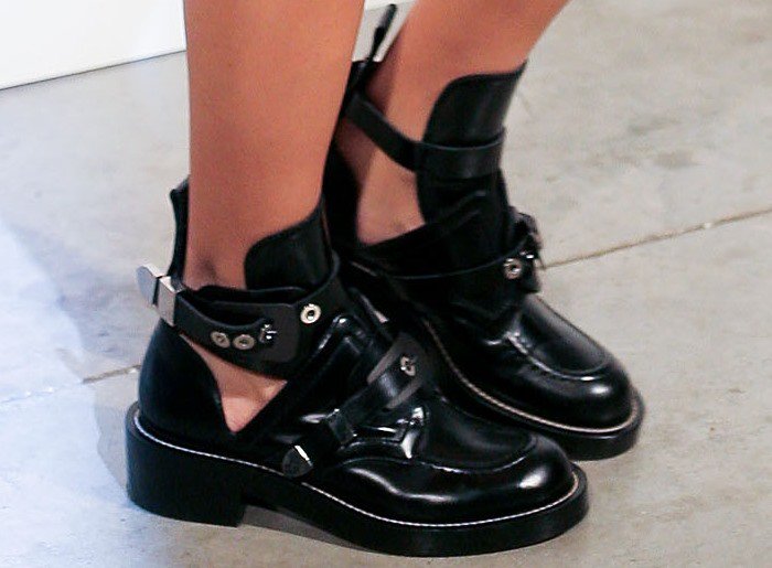 Sofia Sanchez Barrenechea's feet in black leather Balenciaga cutout booties