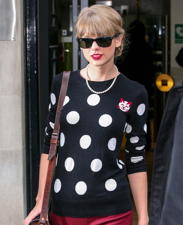 Taylor Swift sporting a French Connection ‘Polka Dot’ sweater and Theory pants in London on November 7, 2012