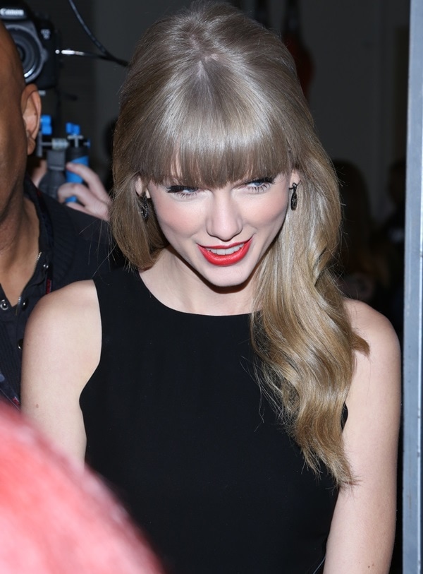 Taylor Swift showcasing a chic and sultry little black dress (LBD) at Z100's Jingle Ball 2012