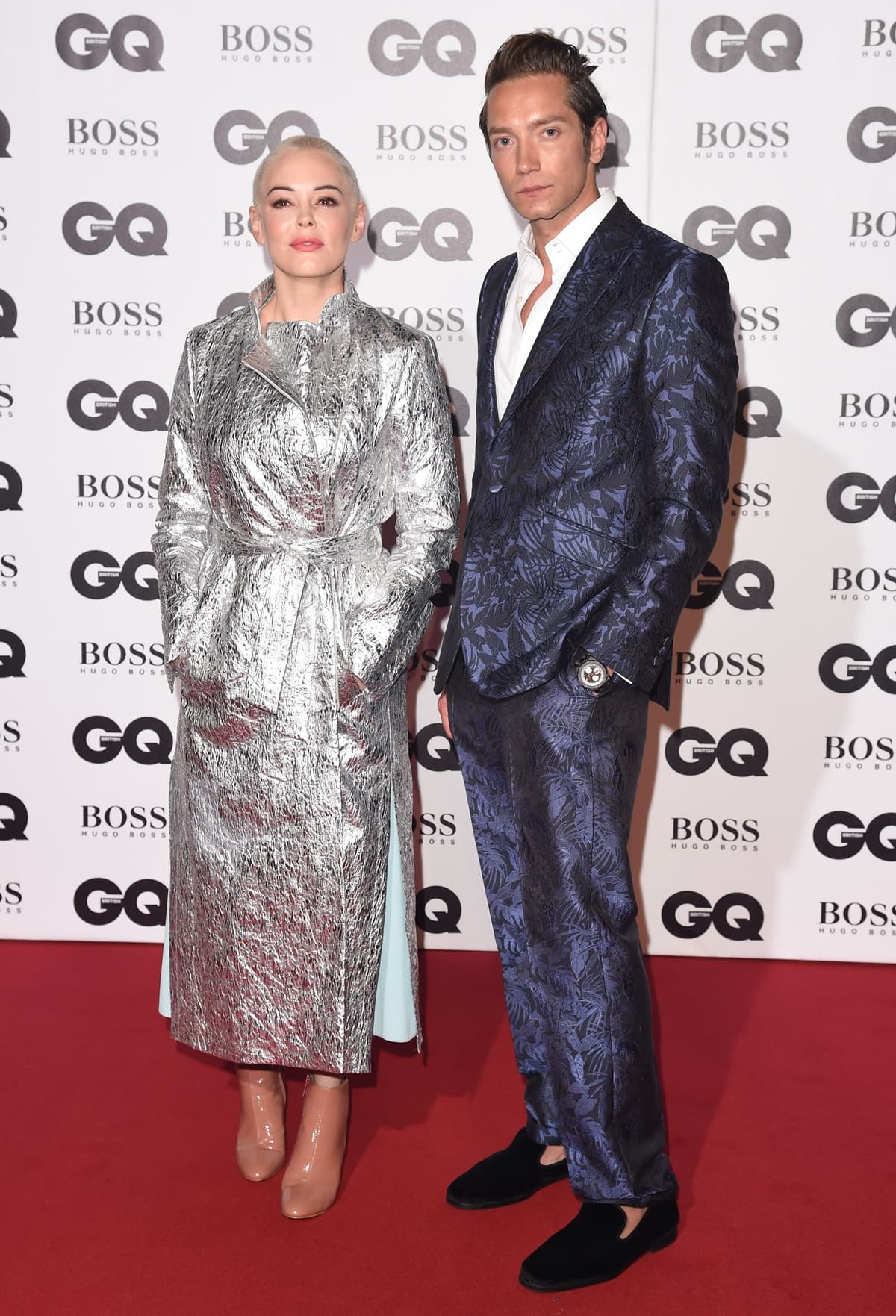 Tomas Auksa (L) and the notably shorter Rose McGowan, who stands at 5 feet 3 inches (160 cm) in height, attended the GQ Men of the Year Awards 2018 in association with HUGO BOSS