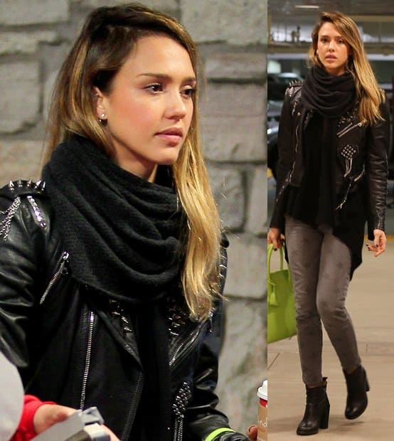 Jessica Alba effortlessly layers a cozy black scarf over a studded leather jacket, grey skinny jeans, and sleek ankle boots while shopping at Target on December 20, 2012