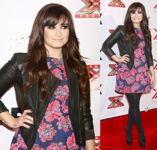 Demi Lovato showcases her new brunette look with side-swept bangs at an X Factor viewing party