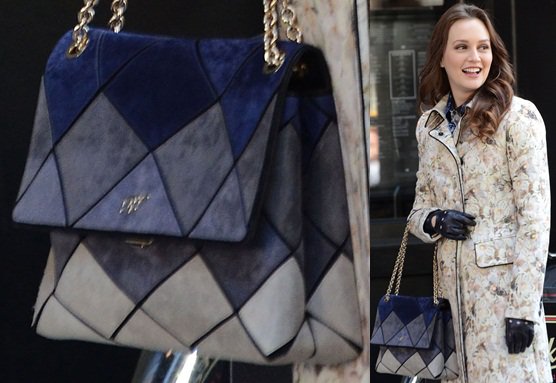 Leighton Meester, embodying Blair Waldorf, captured on the Gossip Girl set in New York, accessorizing with the sophisticated Roger Vivier Prismick Bag