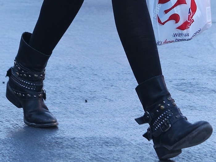 Ashley Tisdale wearing studded cowboy-inspired biker booties