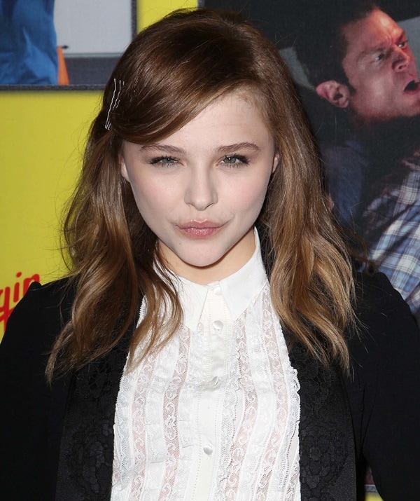 Captured on the red carpet, Chloë Grace Moretz graces the 'Movie 43' Los Angeles Premiere with her presence, showcasing her unique style in Hollywood, California