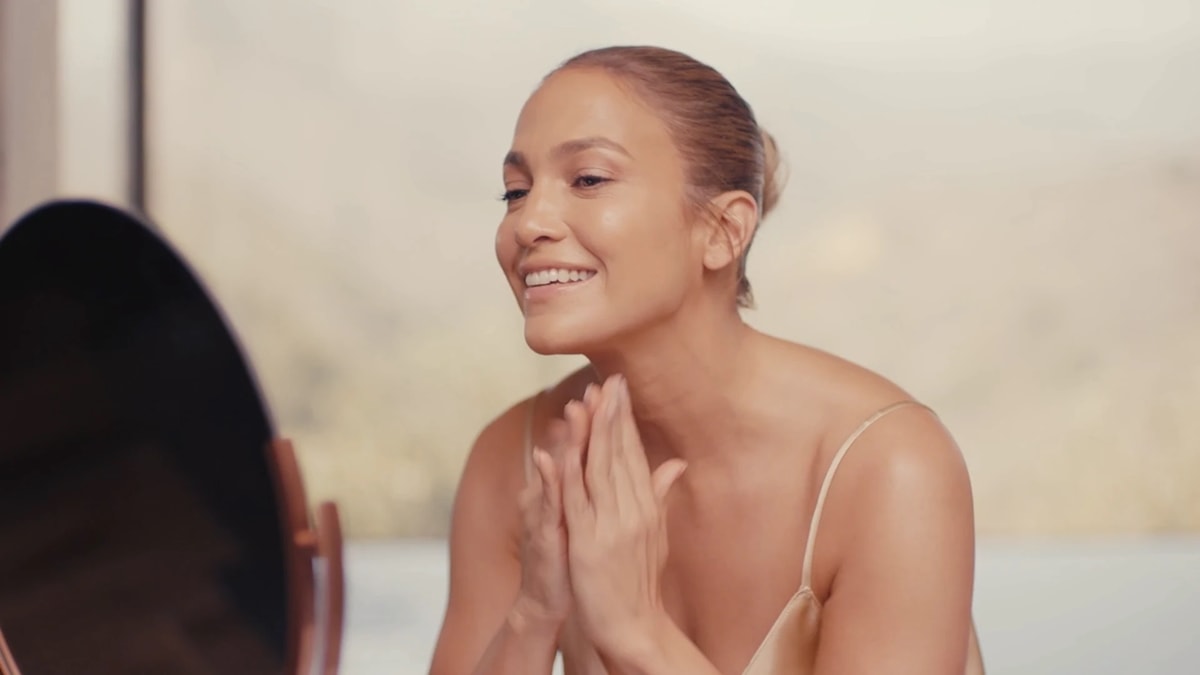 Jennifer Lopez applies her triple-active serum that promises to amp up your glow