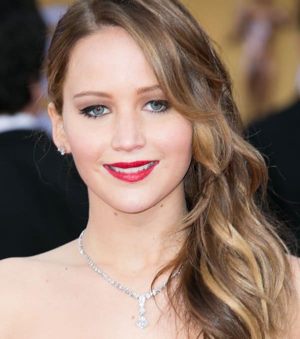 Elegance personified: Jennifer Lawrence dazzles with Chopard jewelry, complementing her side-swept waves at the SAG Awards