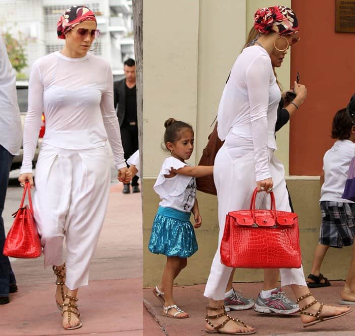 Jennifer Lopez totes a red croc Hermes Birkin bag while enjoying a day with her children