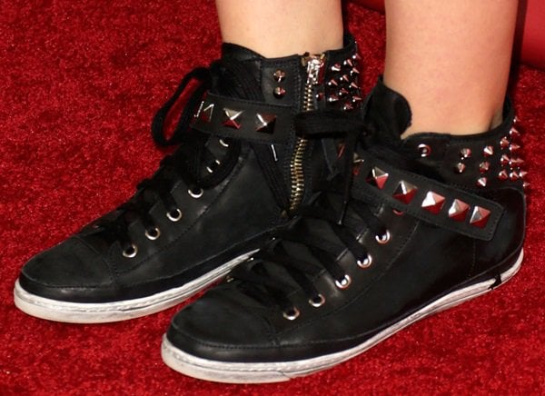 Katharine McPhee in flat black studded sneakers