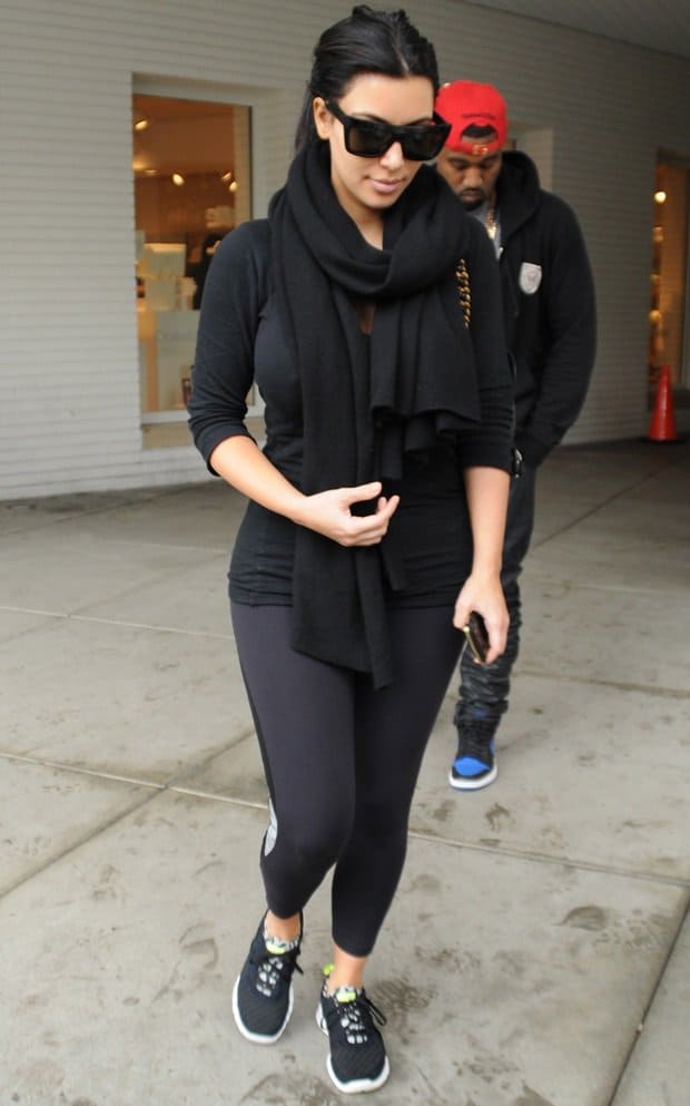 Kim Kardashian styled her workout attire with a black scarf