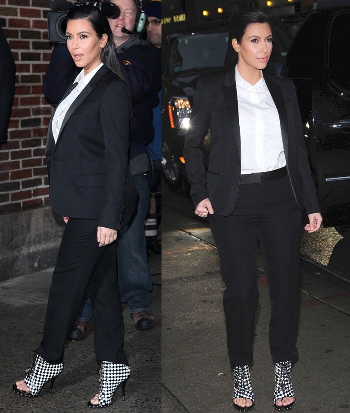 Kim Kardashian shows how to master androgynous chic by pairing a tailored black pantsuit with bold Givenchy checkered booties