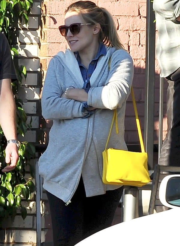 Pregnant Kristen Bell leaving a sushi restaurant after dining with Dax Shepard and friends in Los Angeles