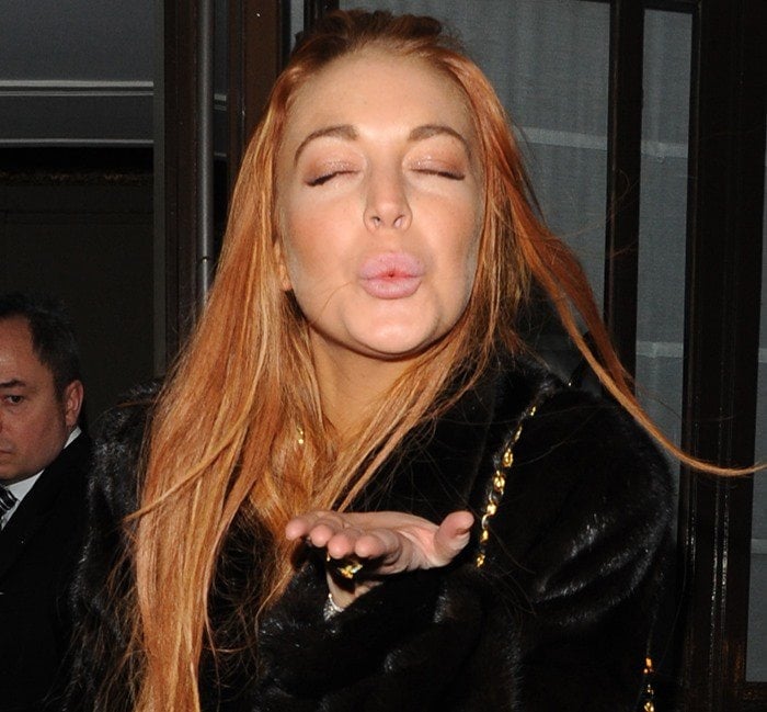 Lindsay Lohan blows a kiss to photographers in London