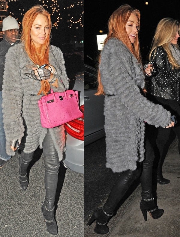 Spotted in London, Lindsay Lohan embraces the cold in style, donning a luxurious fur coat paired with sleek leather pants and stylish black ankle boots for an evening of upscale dining and shopping