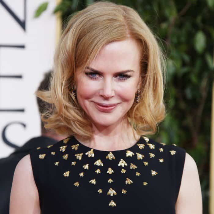 Nicole Kidman showcases a unique Alexander McQueen gown with intricate paneling and mesh insets