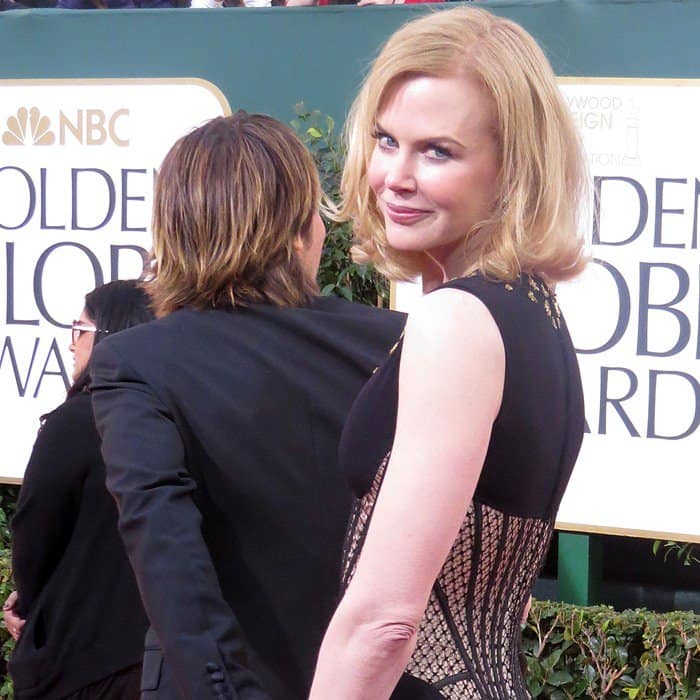 Nicole Kidman in a striking embellished Alexander McQueen gown, captivating on the Golden Globes red carpet