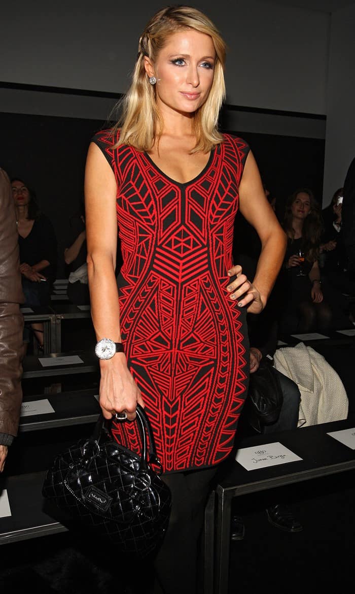 Paris Hilton dazzles at Barcelona Fashion Week, supporting boyfriend River Viiperi, in a distinctive frock during the Mango Autumn/Winter show, January 28, 2013