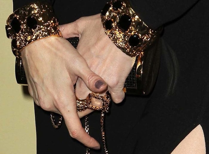 Paz Vega showing off her clutch and jewelry