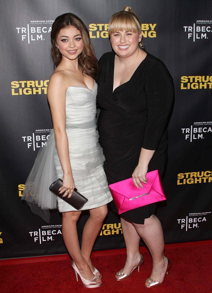 At the Struck By Lightning premiere, Sarah Hyland stuns in ivory platform pumps to match her ruffled mini dress, while Rebel Wilson adds a pop of glam with metallic gold peep-toe heels and a hot pink clutch