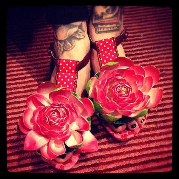 Kat Von D wears a pair of flower-embellished flat sandals