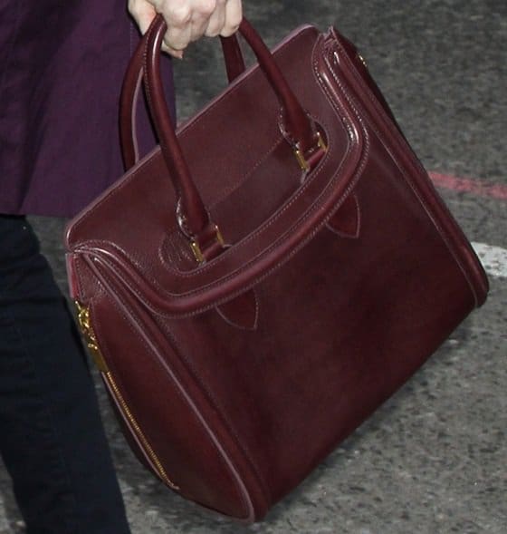 Jessica Chastain carrying the gorgeous oxblood Alexander McQueen Heroine bag