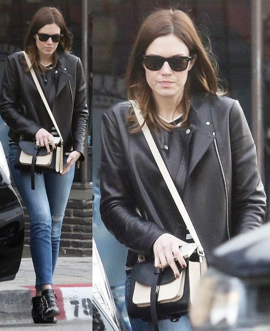 Mandy Moore wears and a leather jacket and jeans in Los Angeles