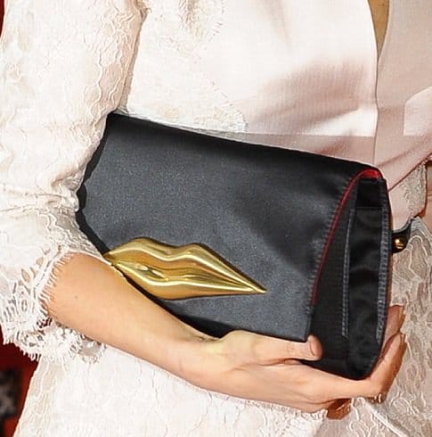 Tess Daly totes a Carolina Lip clutch from Diane Von Furstenberg