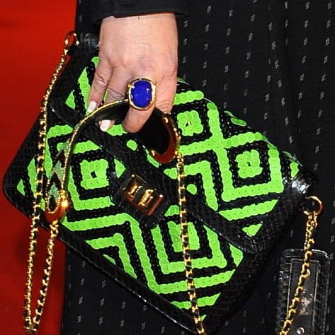 Fay Ripley totes a green and black sequined clutch