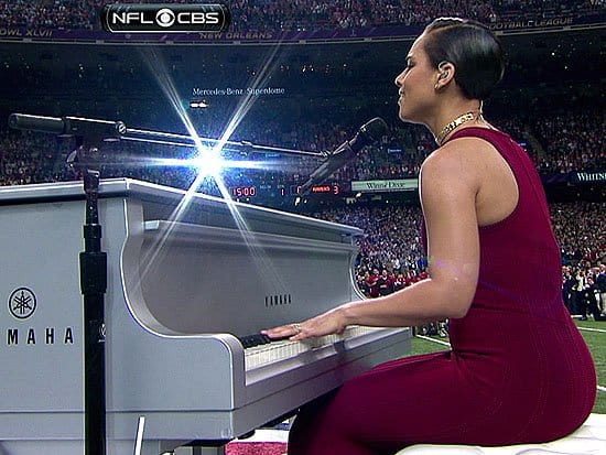 Alicia Keys wore a floor-length red gown by Azzedine Alaïa