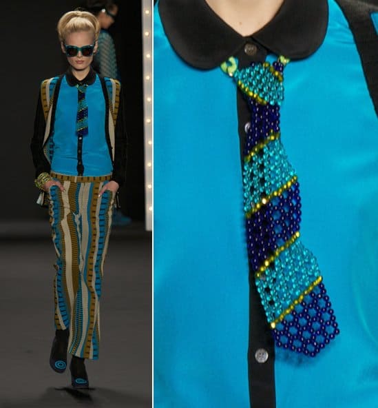 A model wears a blue beaded necktie on the runway at the Anna Sui Ready to Wear Fall/Winter 2013-2014 fashion show