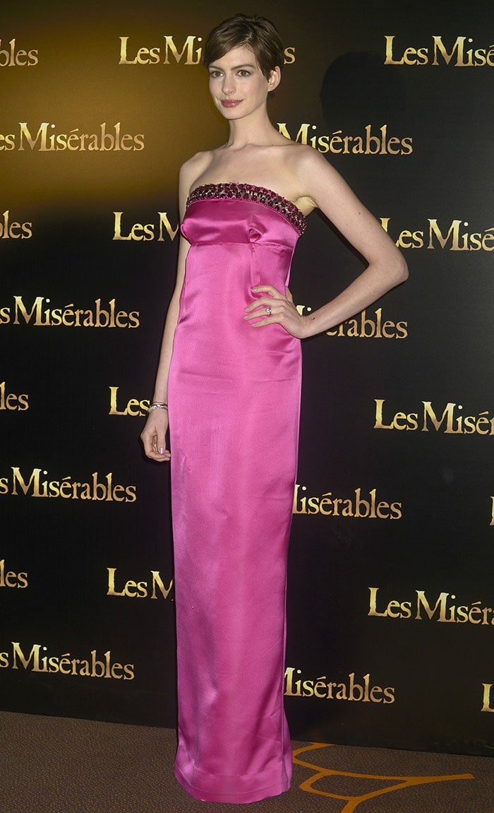 Anne Hathaway attends the Paris premiere of "Les Miserables" in a floor-length Prada gown