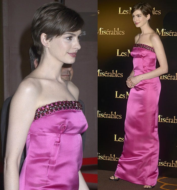 Anne Hathaway skips the necklace to show off the bejeweled neckline of her Prada dress