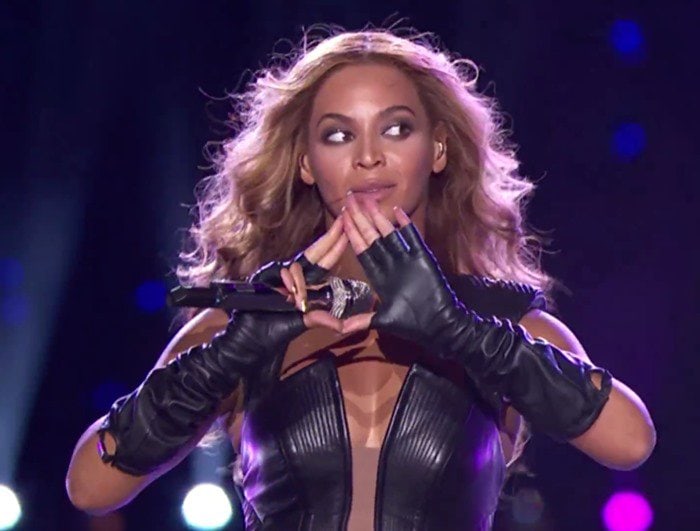 Beyonce performs at the Super Bowl wearing a black leather bodysuit from Rubin Singer