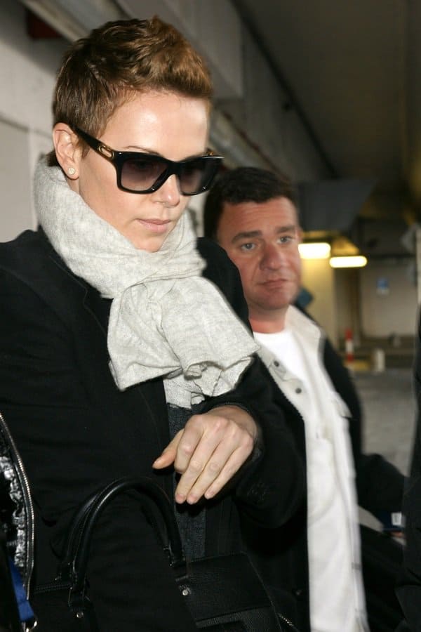 Charlize Theron redefines style with her edgy androgynous look at Berlin Tegel Airport