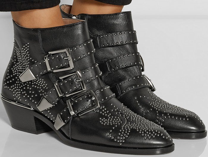Beautiful studs pepper an iconic belted bootie with elevated-Western appeal