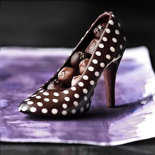 Andrea Pedraza's renowned creations are none other than chocolate pumps, meticulously crafted to resemble the iconic style of Christian Louboutin shoes
