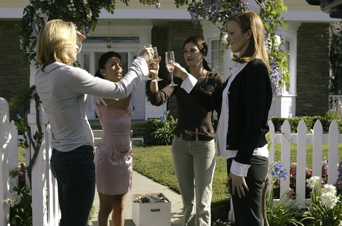 Felicity Huffman (as Lynette Scavo), Eva Longoria (as Gabrielle Solis), Teri Hatcher (as Susan Mayer), Marcia Cross (as Bree Van De Kamp) in the pilot episode of the American dramedy-mystery series Desperate Housewives that premiered on October 3, 2004