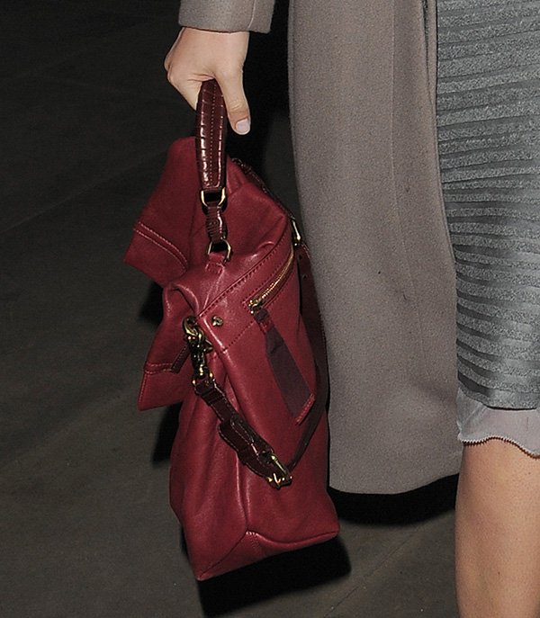 Gemma Arterton showcases her exquisite Nina Ricci 'Liane' satchel, a perfect blend of luxury and versatility