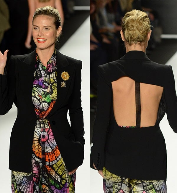 Heidi Klum in a black blazer paired with a silk jumpsuit featuring stained glass window prints on the runway before the 11th Season Finale of Project Runway Fashion Show