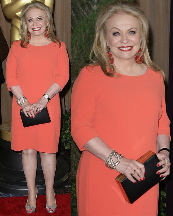 Jacki Weaver in a bright orange dress at the 85th Academy Awards Nominees Luncheon