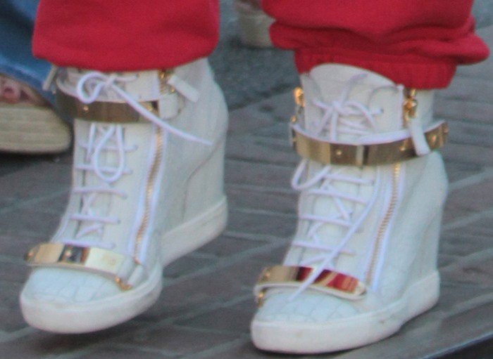 Jennifer Lopez rocks gold Giuseppe Zanotti sneakers