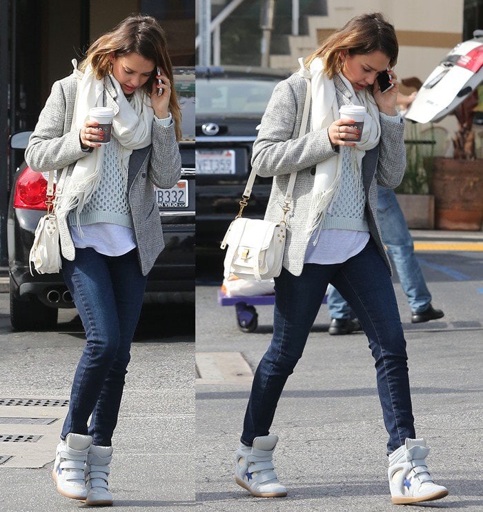 Jessica Alba wears a casual outfit with a pair of blue-and-white wedge sneakers