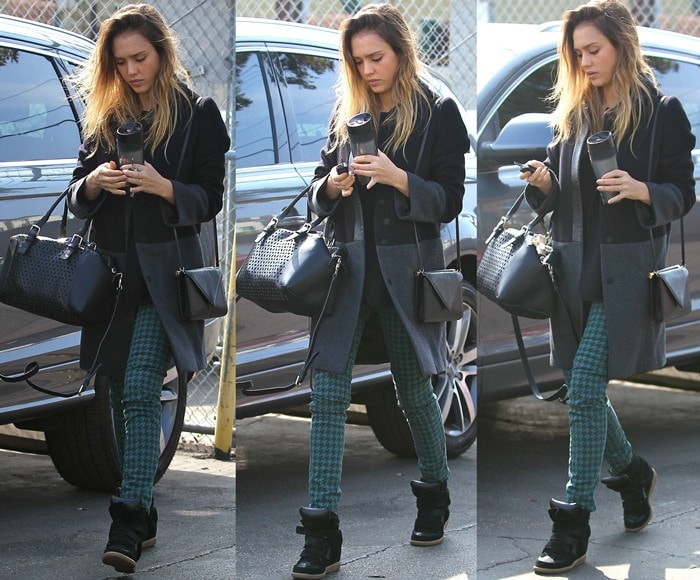 Jessica Alba wears houndstooth skinny jeans and a black jacket while out in Santa Monica