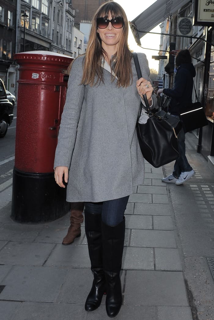 On February 19, 2013, in London, Jessica Biel was seen in a chic outfit composed of a Fendi 2jours Elite leather shopper, Rag & Bone legging jeans in Derby, Tom Ford Lydia sunglasses, an Autumn Cashmere cape, a Nation Ltd No Name T-shirt, and Golden Goose Charlye black hi boots