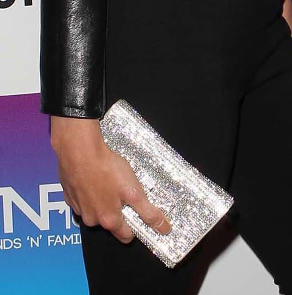 Jessica Sutta's silver glittery purse