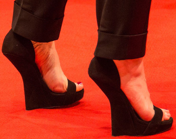 Juliette Binoche's feet in black suede Giuseppe Zanotti heel-less wedges