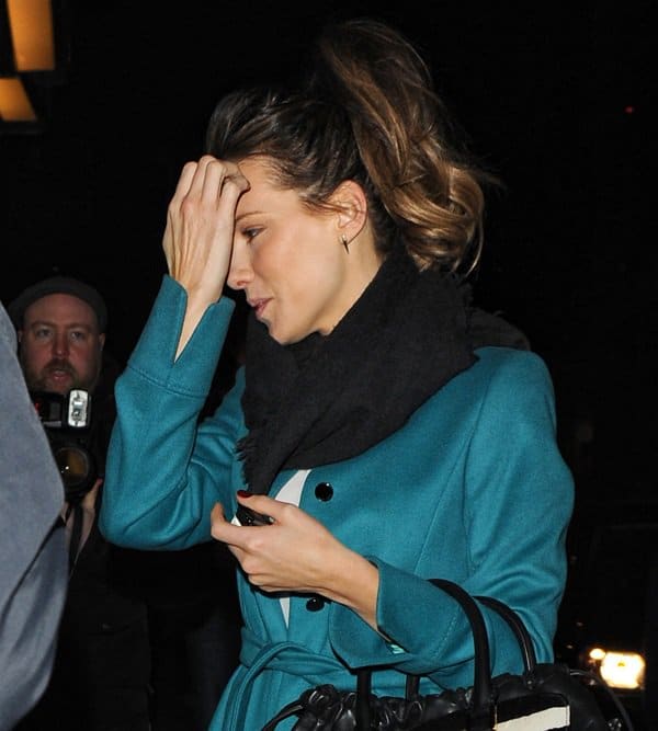 Kate Beckinsale styled her blue trench coat with a black scarf