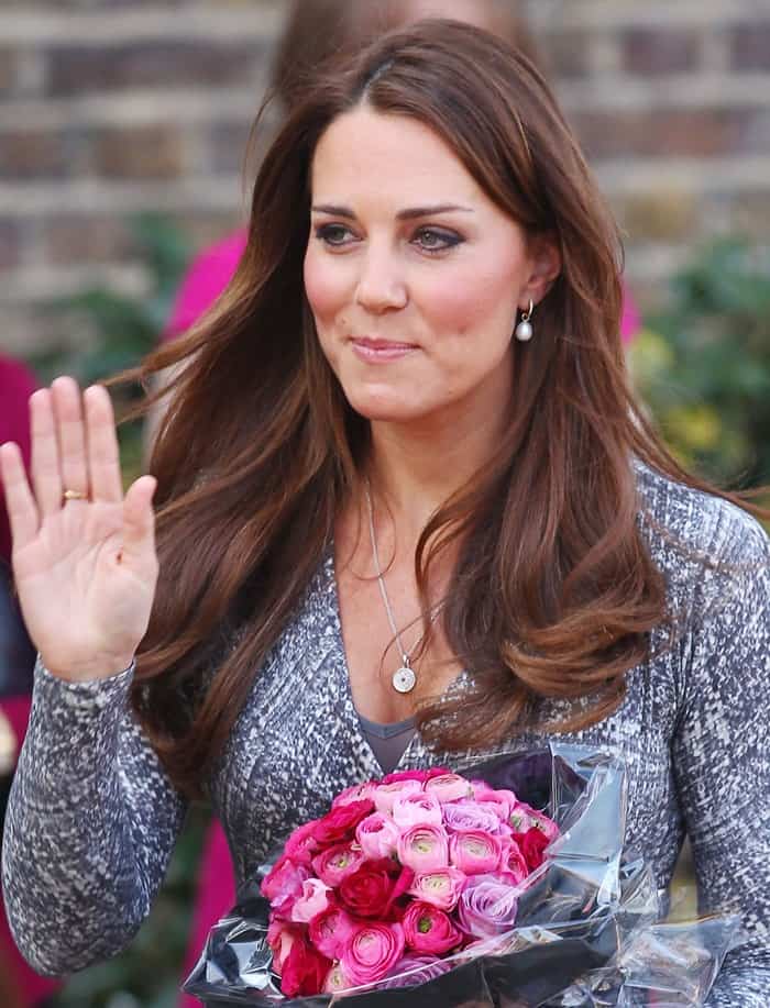 Kate Middleton accessorized her outfit with Annoushka pearl earrings and an Asprey button pendant