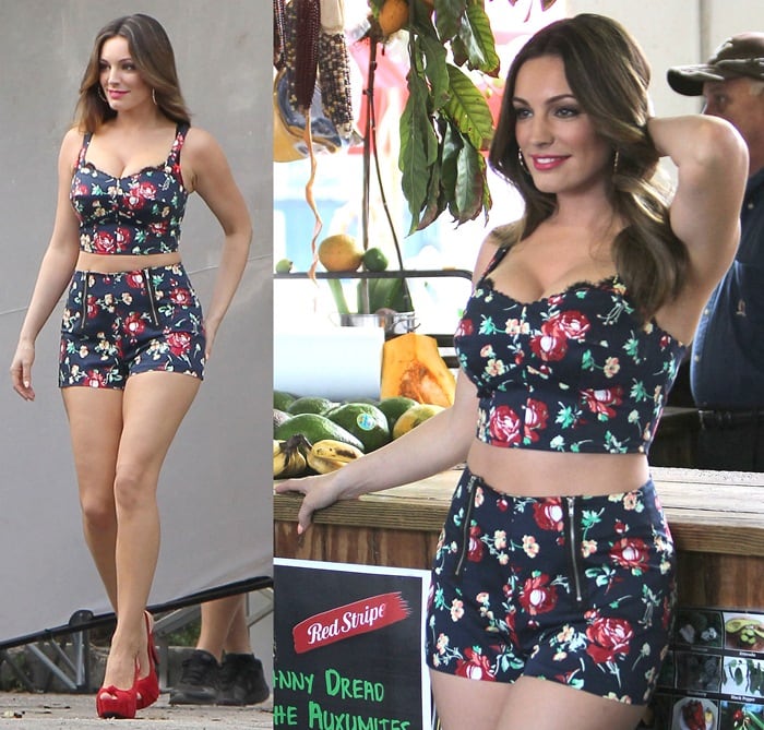 Kelly Brook stuns in a floral crop top and matching shorts, paired perfectly with bold red heels for a playful, summer-ready look that turns heads