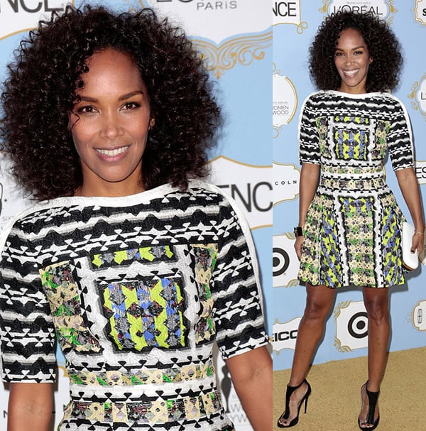 Mara Brock Akil looks radiant in a multicolored embroidered Peter Pilotto mini dress with seersucker texture, paired perfectly with black ankle-strap Jimmy Choo sandals
